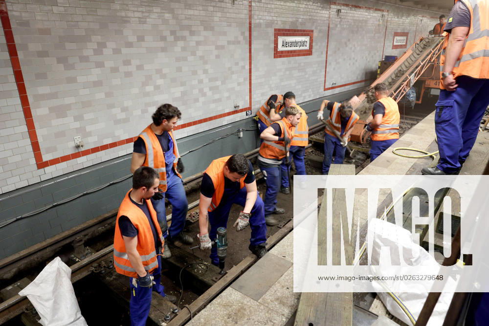 Berlin Germany At the Alexanderplatz underground station, construction work is underway on the U2 track, which has been closed due to an accident Holes are drilled for planks, the straight line is measured and then the screws are tightened.