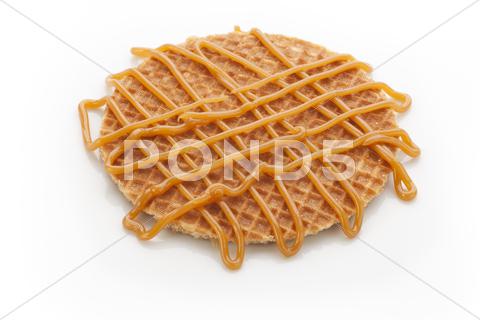 Dutch stroopwafel with caramel topping isolated on white background. caramel, sweets, breakfast, cakes, cookie, delicious, dessert, dutch, food, holland, isolated, stroopwafel, sweet, waffle