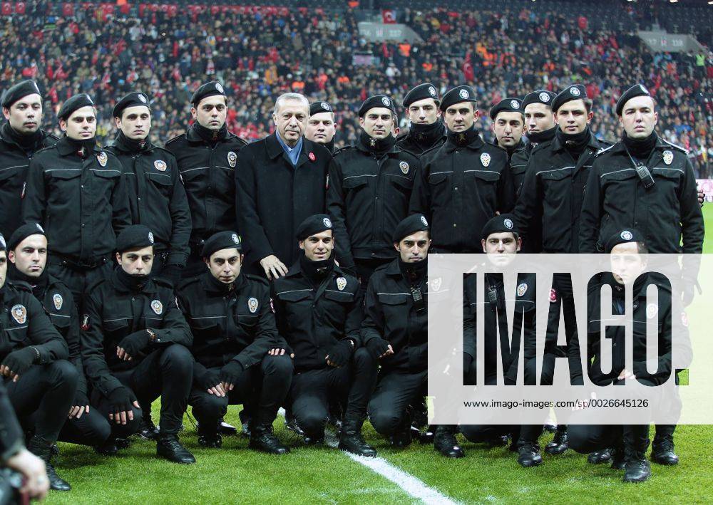 Turkish President Recep Tayyip Erdogan poses with the Turkish polices before a friendly football match held for the martyrs killed on the recent terror attacks in Turkey, at Vodafone Arena in Istanbul, Turkey on December 22, 2016. Foreign and Turkish footballers from Turkish Spor Toto Super League s 18 team, compete at the friendly match and the income of the match will be donated to relatives of the martyrs.