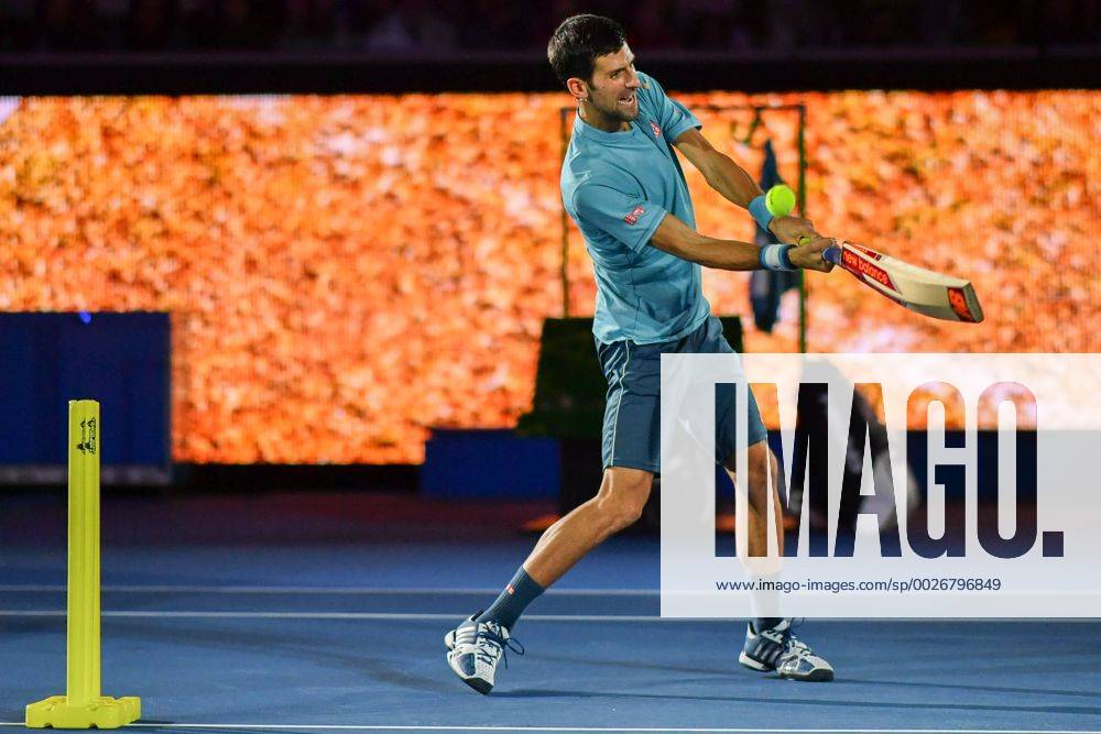 Novak Djokovic of Serbia hits the ball with a cricket bat during a free charity event A Night with Novak to raise money for his Novak Djokovic Foundation at Margaret Court Arena in Melbourne, Australia. Cal Media Tennis 2017: A Night with Novak event - ZUMAc04_ 20170111_zaf_c04_024
