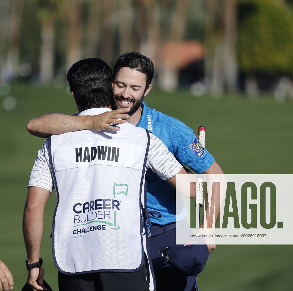 Adam Hadwin of Canada hugs his caddie Joe Cruz after shooting a 59 during the third round of the CareerBuilder Challenge at La Quinta Country Club in La Quinta, California. CSM GOLF 2017: CareerBuilder Challenge JAN 21 - ZUMAc04_ 20170121_zaf_c04_349