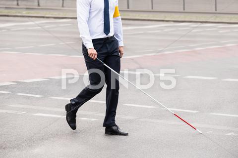 Blind Person With White Stick Walking On Street accessibility, adult, arm, armband, assistance, band, blind, blindness, cane, care, close-up, closeup, cross, crossing, depend, disability, guidance, guide, handicap, handicapped, health, healthcare, holding, icon, leisure, man, necktie, one, outdoor, people, person, protect, protection, road, safe, safety, sick, sickness, sign, stick, street, symbol, tie, vision, walking, yellow, young