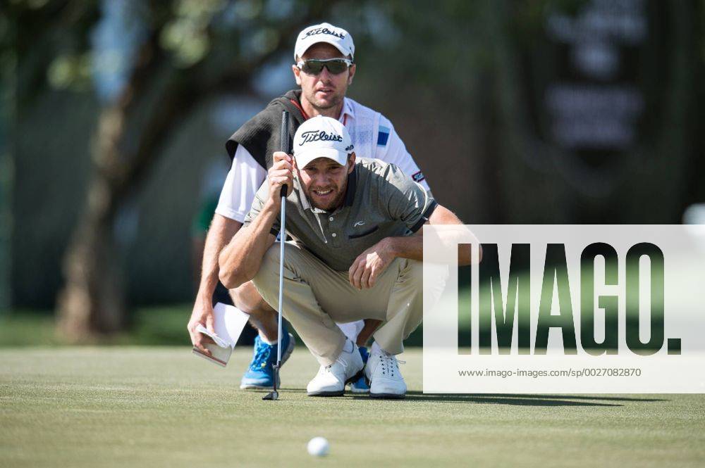 Maximillian Kieffer of Germany lines up a putt with his caddy during the PGA Golf Herren European Tour Dubai Desert Classic Tournament Day 3 at the Emirates Golf Club, Dubai, UAE on 4 February 2017.