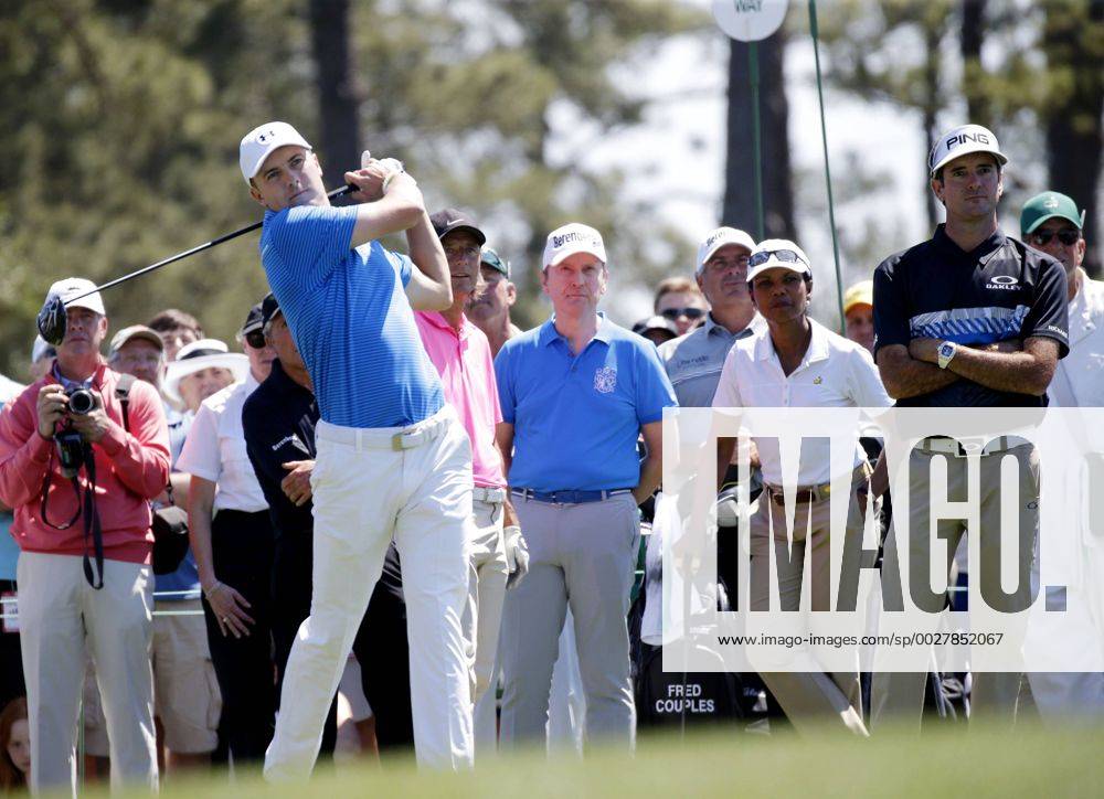 Former United States Secretary of State Condoleezza Rice and Bubba Watson watch Jordan Spieth hit a tee shot while playing a practice round at the 2017 Masters Tournament at Augusta National Golf Club in Augusta, Georgia on April 2, 2017. AUG20170402110 JOHNxANGELILLO