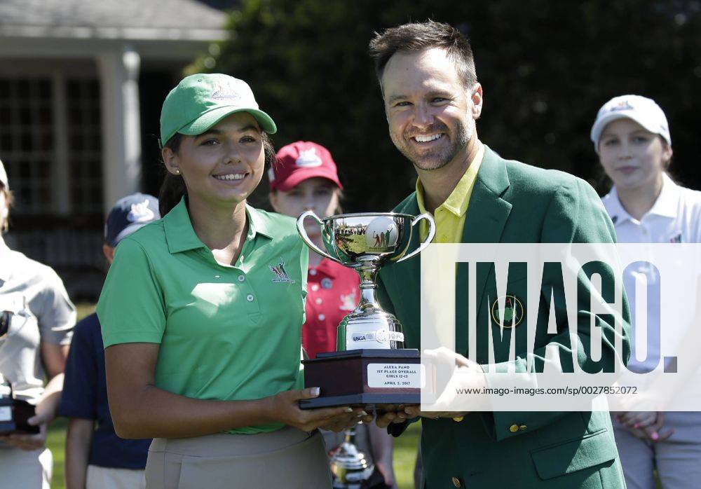 Past Masters champion Trevor Immelman stands with Alexa Pano who wins the overall in the Drive, Chip & Putt Championship for Girls age 12-13 at the 2017 Masters Tournament at Augusta National Golf Club in Augusta, Georgia on April 2, 2017. AUG20170402115 JOHNxANGELILLO