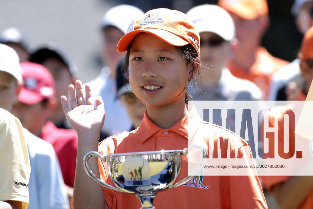 Maye Huang overall winner of the Girls 7-9 age group Drive, Chip & Putt Championship waves at the trophy ceremony at the 2017 Masters Tournament at Augusta National Golf Club in Augusta, Georgia on April 2, 2017. AUG20170402125 JOHNxANGELILLO