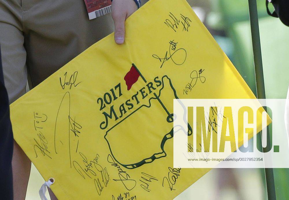 A boy holds an autographed Masters flag at a practice round at the 2017 Masters Tournament at Augusta National Golf Club in Augusta, Georgia on April 2, 2017. AUG20170402103 JOHNxANGELILLO