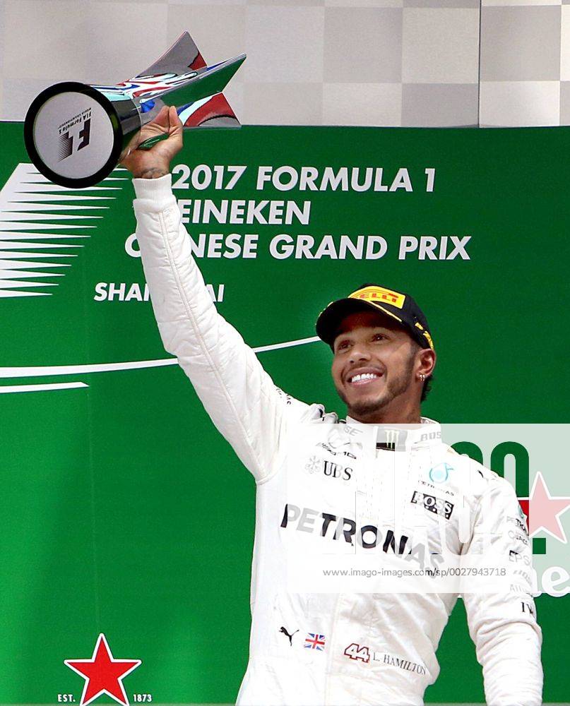 (170409) -- SHANGHAI, April 9, 2017 -- Mercedes driver Lewis Hamilton of Britain celebrates with the trophy on the podium after winning the Formula One Chinese Grand Prix at the Shanghai International Circuit in Shanghai, east China, April 9, 2017. ) (SP)CHINA-SHANGHAI-F1-2017 CHINESE GRAND PRIX(CN) fanxjun
