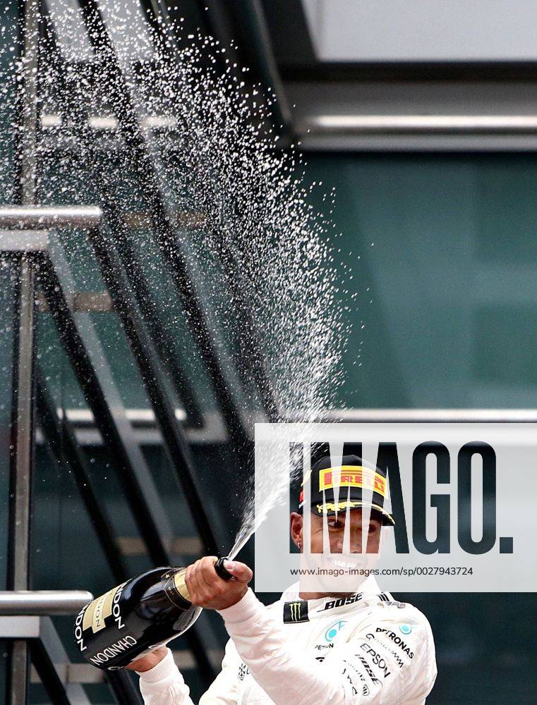 (170409) -- SHANGHAI, April 9, 2017 -- Mercedes driver Lewis Hamilton of Britain celebrates with champagne on the podium after winning the Formula One Chinese Grand Prix at the Shanghai International Circuit in Shanghai, east China, April 9, 2017. ) (SP)CHINA-SHANGHAI-F1-2017 CHINESE GRAND PRIX(CN) fanxjun