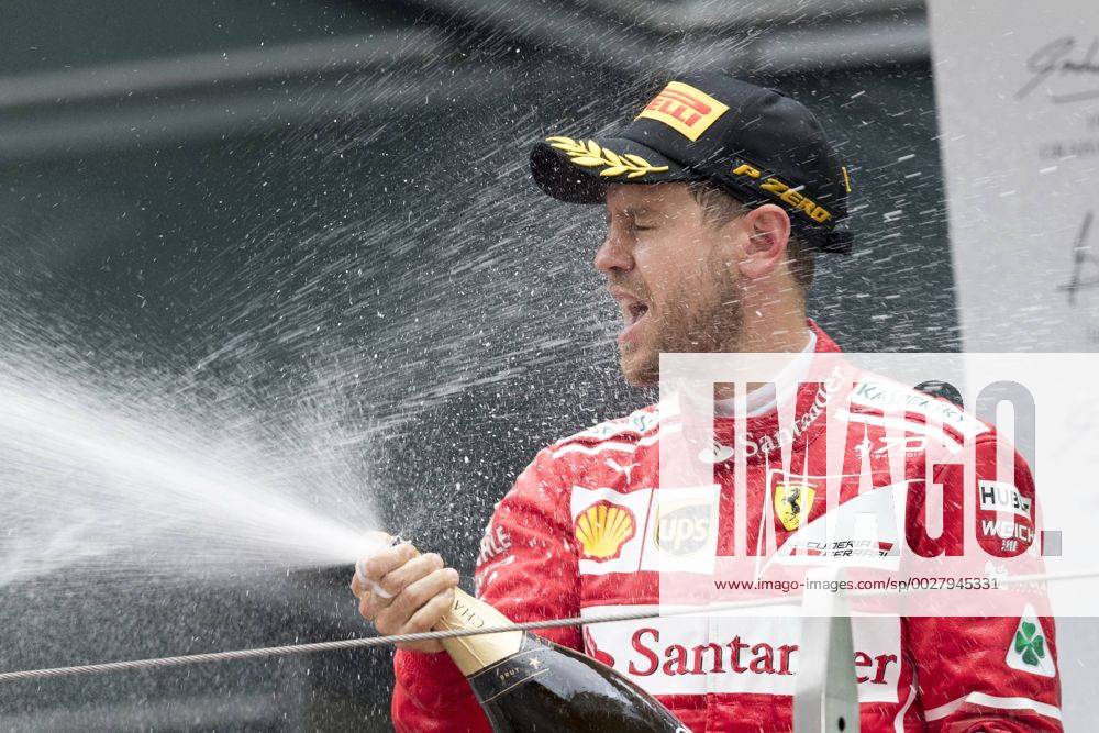 German F1 Sebastian Vettel of Ferrari sprays champagne to celebrate during the award presentation ceremony after winning the first runner-up of the 2017 Formula 1 Chinese Grand Prix at the Shanghai International Circuit in Shanghai, China, 9 April 2017. Lewis Hamilton wins Formula 1 Chinese Grand Prix 20170409_62991