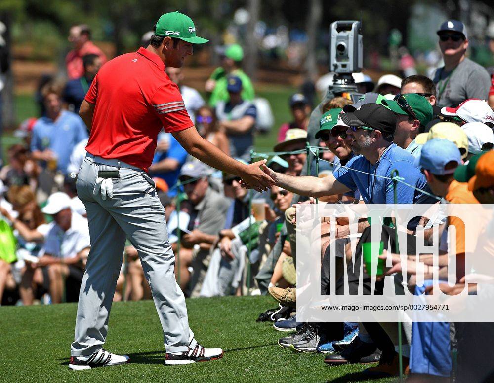 Augusta, GA, USA - Jon Rahm, left, shakes hands with the fan he hit with his ball along the second green during the final round of the Masters Tournament on Sunday, April 9, 2017 at Augusta National Golf Club in Augusta, Ga. 2017 Masters Round 4 - ZUMAm67_ 20170409_zaf_m67_045