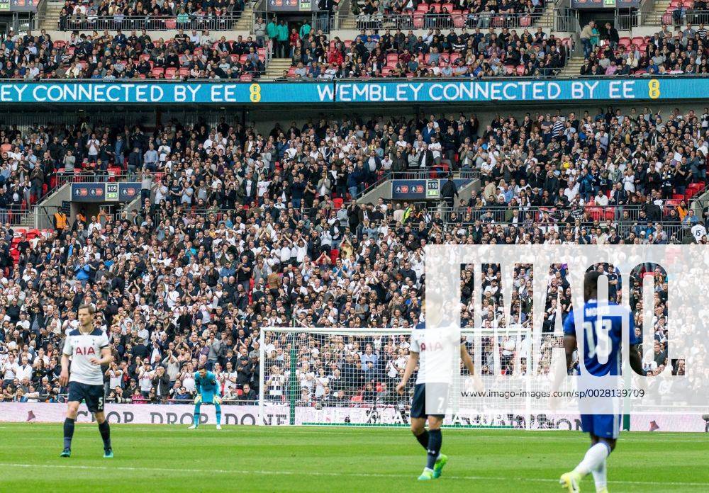 Tottenham Hotspur supporters pay an extra tribute to Ugo Ehiogu by applauding at the 44th minute mark during the the Emirates FA Cup Semi-Final match between Chelsea and Tottenham Hotspur at Wembley Stadium, London, England on the 22nd April 2017.