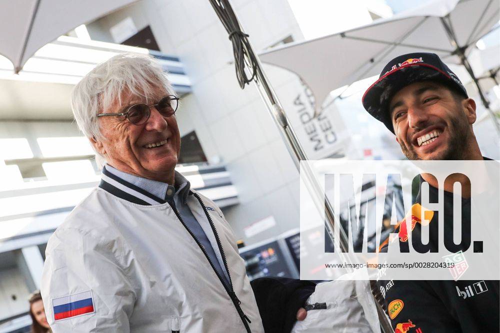 Bernard Charles Bernie Ecclestone (L), president of the Formula One Management and Formula 1 Administration (FOA), and Australian driver Daniel Ricciardo of the Red Bull Racing F1 Team talking in a paddock at the Sochi Autodrom racing circuit ahead of the 2017 Formula One Russian Grand Prix. Vyacheslav Prokofyev TASS TS049E72