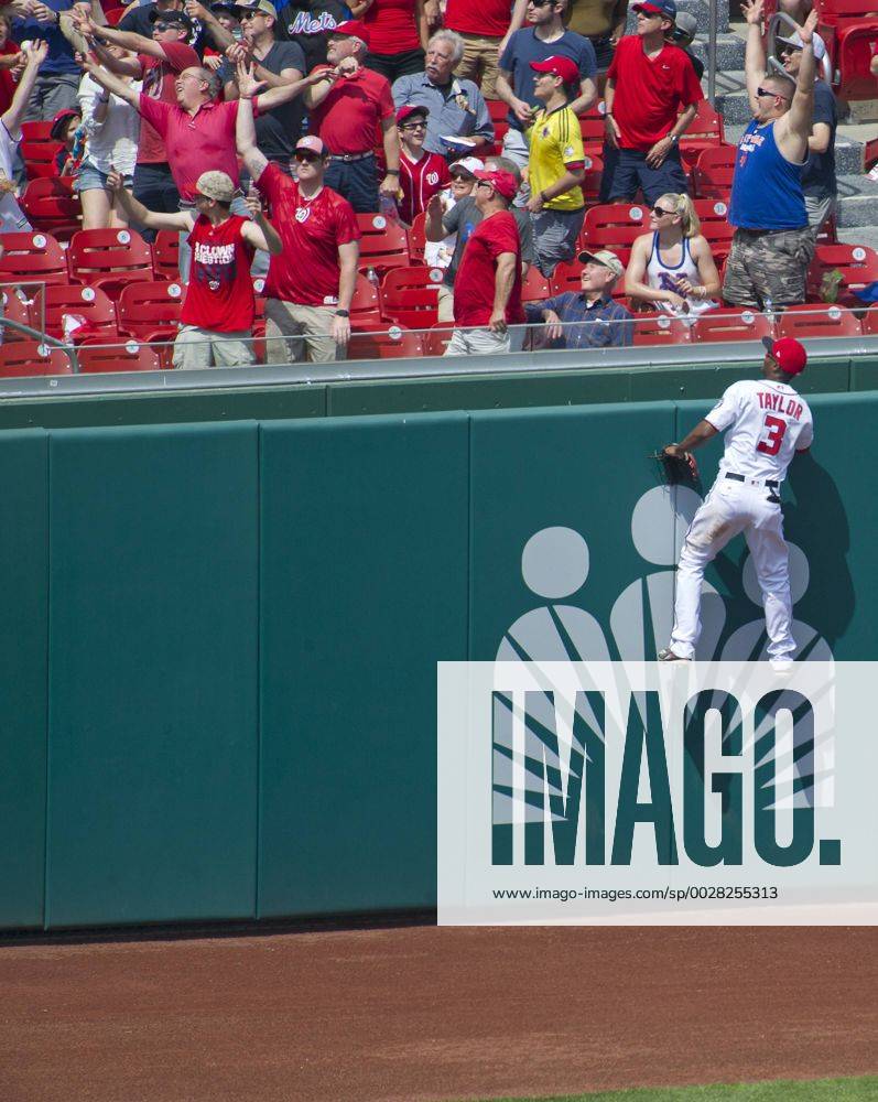 Washington, District of Columbia, United States of America - Washington Nationals center fielder Michael Taylor (3) leaps in a vain attempt to catch a ball off the bat of New York Mets catcher Rene Rivera (44) in the second inning that went for a home run at Nationals Park in Washington, D.C. on Sunday, April 30, 2017. The landed five rows back and can be seen in the upper left corner..Credit: CNP New York Mets vs Washington Nationals - ZUMAs152 78320101st