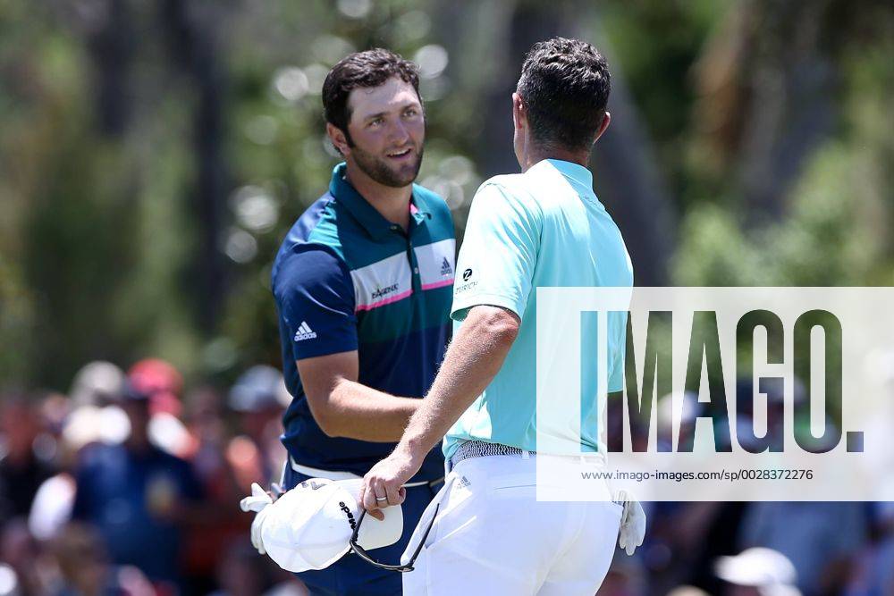Ponte Vedra Beach, Florida, United States - Jon Rahm (L) shakes hands with Justin Rose on the 9th green after the second round of The PLAYERS Championship at TPC Sawgrass. Golf 2017: The PLAYERS Championship - Round 2 - ZUMAw109 20170512_zap_w109_044