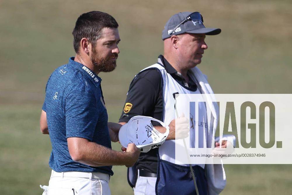 Ponte Vedra Beach, Florida, United States - Louis Oosthuizen (L) and his caddie Greg Hearmon on the 9th green after the second round of The PLAYERS Championship at TPC Sawgrass. Golf 2017: The PLAYERS Championship - Round 2 - ZUMAw109 20170512_zap_w109_073