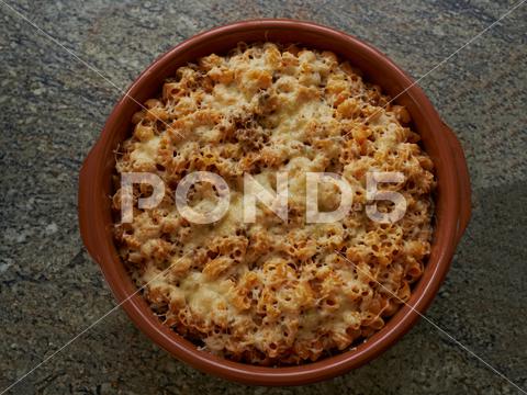 A top view of delicious macaroni cheese in a ceramic pan food, meal, healthy, pasta, white, lunch, cheese, plate, delicious, breakfast, cook, background, fresh, macaroni, dinner, ingredient, gourmet, dairy, nutrition, tasty, mac, dish, pan, ceramic, fragile, bake, cheddar, sauce, top, view, melt