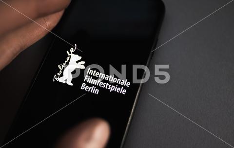 Berlin International Film Festival logo on smartphone screen. High quality photo. 2020, advertisement, architecture, art, atmosphere, award, background, bear, beautiful, berlin, berlin international film festival, berlinale, berlinale bear, cinema, colorful, competition, concert, creative, culture, design, entertainment, europe, event, february, festival, film, film market, fire, germany, golden, illustrative editorial, industry, international, logo, logotype, modern, movie, music, opening, people, poster, premiere, programme, screen, sign, smartphone, symbol, theater, tourism