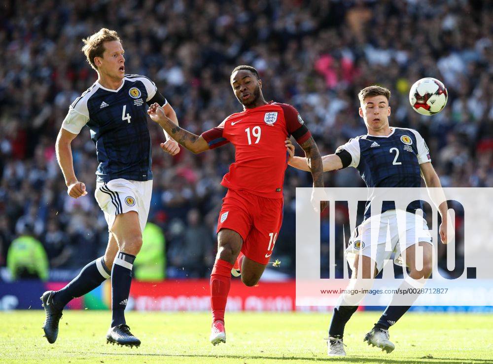 Scotland s Christophe Berra and Kieran Tierney tussle with England s Raheem Sterling during the FIFA World Cup WM Weltmeisterschaft Fussball Qualifying match at Hampden Park Stadium, Glasgow Picture date 10th June 2017. Picture credit should read: David Klein Sportimage .