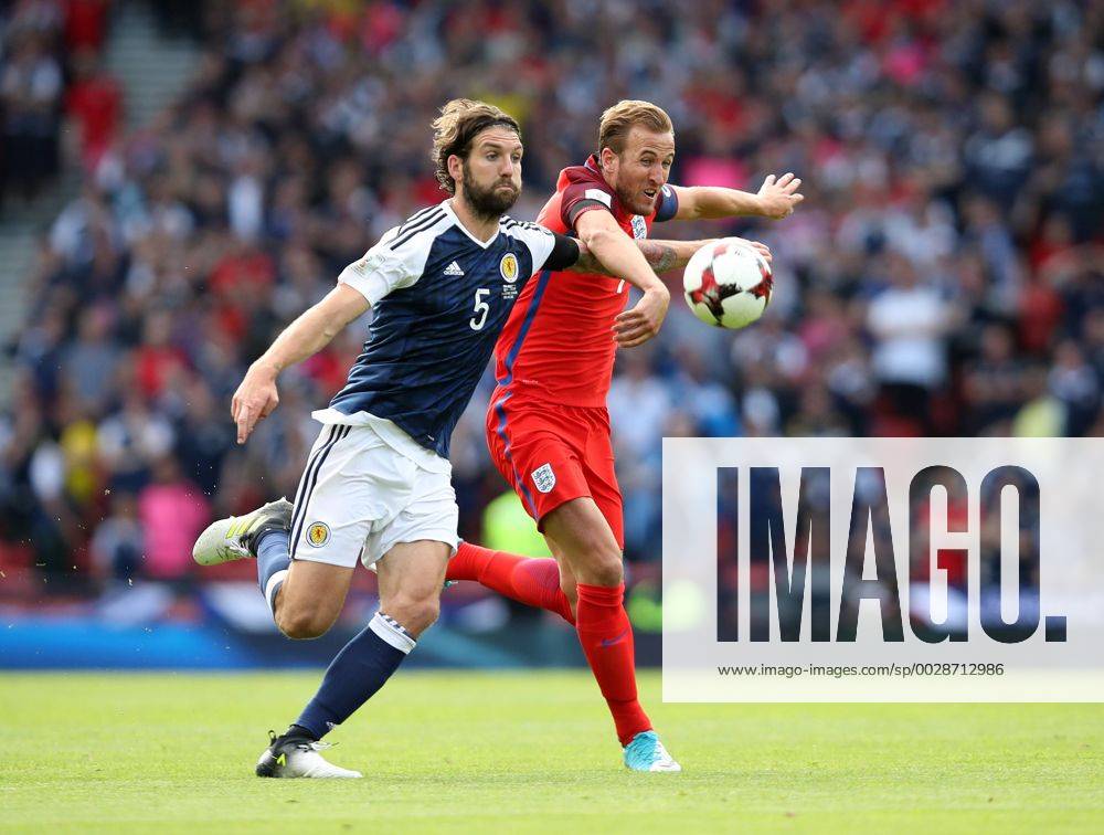 Scotland s Charlie Mulgrew tussles with England s Harry Kane during the FIFA World Cup WM Weltmeisterschaft Fussball Qualifying match at Hampden Park Stadium, Glasgow Picture date 10th June 2017. Picture credit should read: David Klein Sportimage .