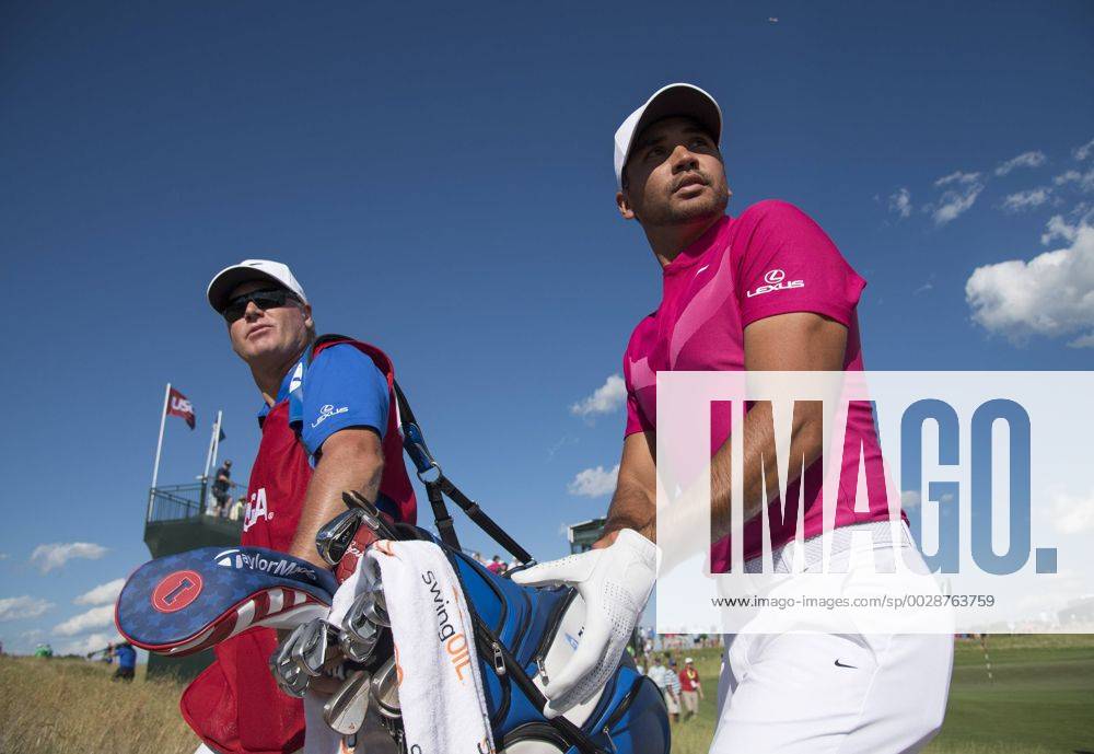 Jason Day and his caddie Col Swatton walk off the 10th green during round 1 of the 117th U.S. Open golf tournament at Erin Hill golf course in Erin, Wisconsin on June 15, 2017. WIS20170615351 KEVINxDIETSCH