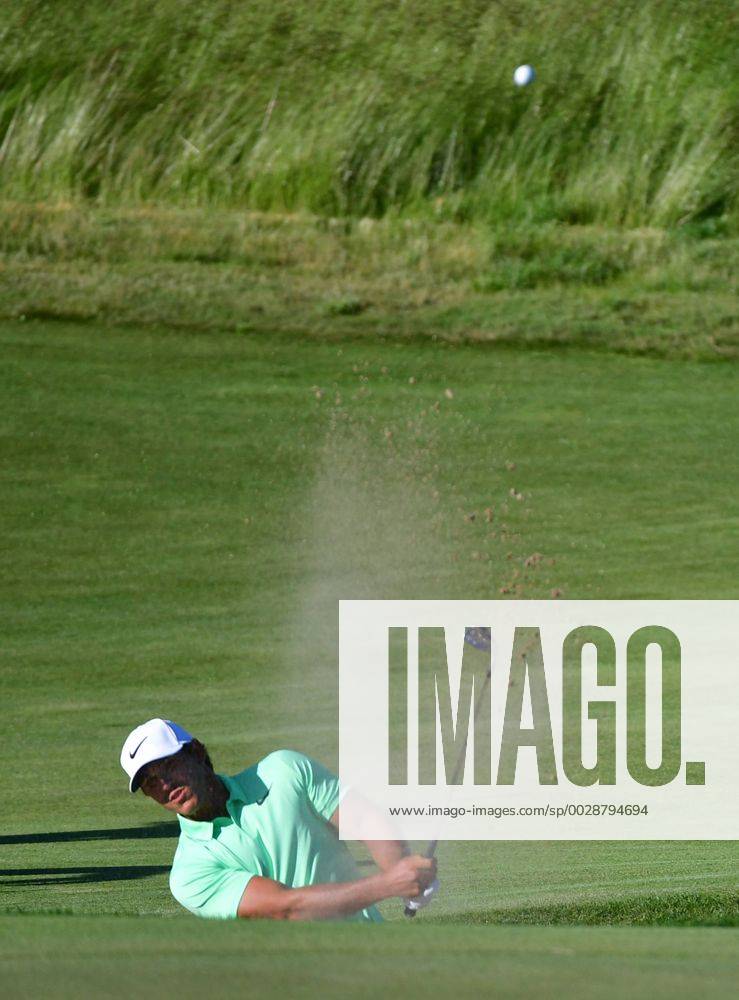 Brooks Koepka blasts from the No. 14 bunker during the final round of the 117th U.S. Open golf tournament at Erin Hill golf course on June 17, 2017, in Erin, Wisconsin. WIS20170618559 KEVINxDIETSCH