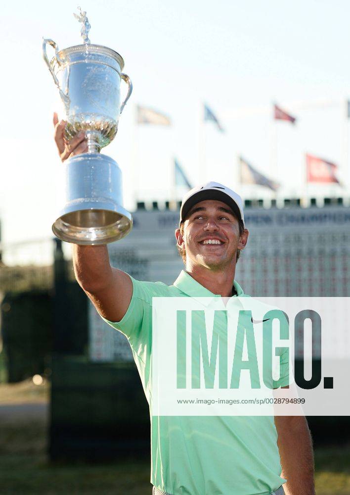 Brooks Koepka poses with the U.S. Open Trophy after the final round of the 117th U.S. Open golf tournament at Erin Hills golf course on June 18, 2017 in Erin, Wisconsin. Koepka shot a 16-under 272 to win the tournament by 4 strokes. WIS20170618102 BRIANxKERSEY
