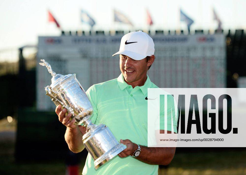 Brooks Koepka poses with the U.S. Open Trophy after the final round of the 117th U.S. Open golf tournament at Erin Hills golf course on June 18, 2017 in Erin, Wisconsin. Koepka shot a 16-under 272 to win the tournament by 4 strokes. WIS20170618103 BRIANxKERSEY