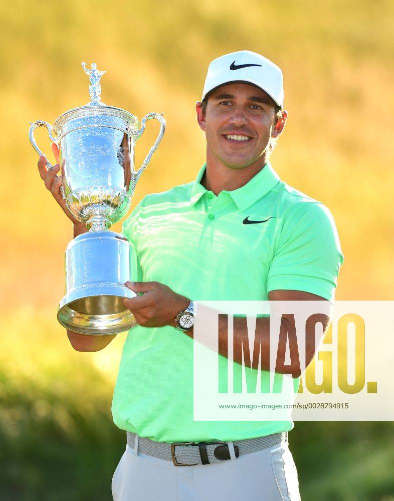 Brooks Koepka poses with the trophy after winning the 117th U.S. Open golf tournament at Erin Hills golf course on June 18, 2017, in Erin, Wisconsin. Koepka posted a final score of 16-under-par. WIS20170618309 KEVINxDIETSCH
