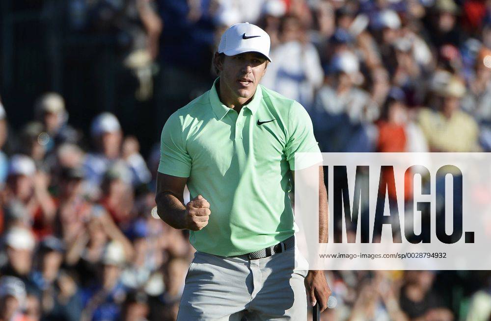 Brooks Koepka clenches his fist after putting out for par to win the 117th U.S. Open golf tournament at Erin Hill golf course with a 16-under-par total score on June 18, 2017, in Erin, Wisconsin. WIS20170618566 BRIANxKERSEY