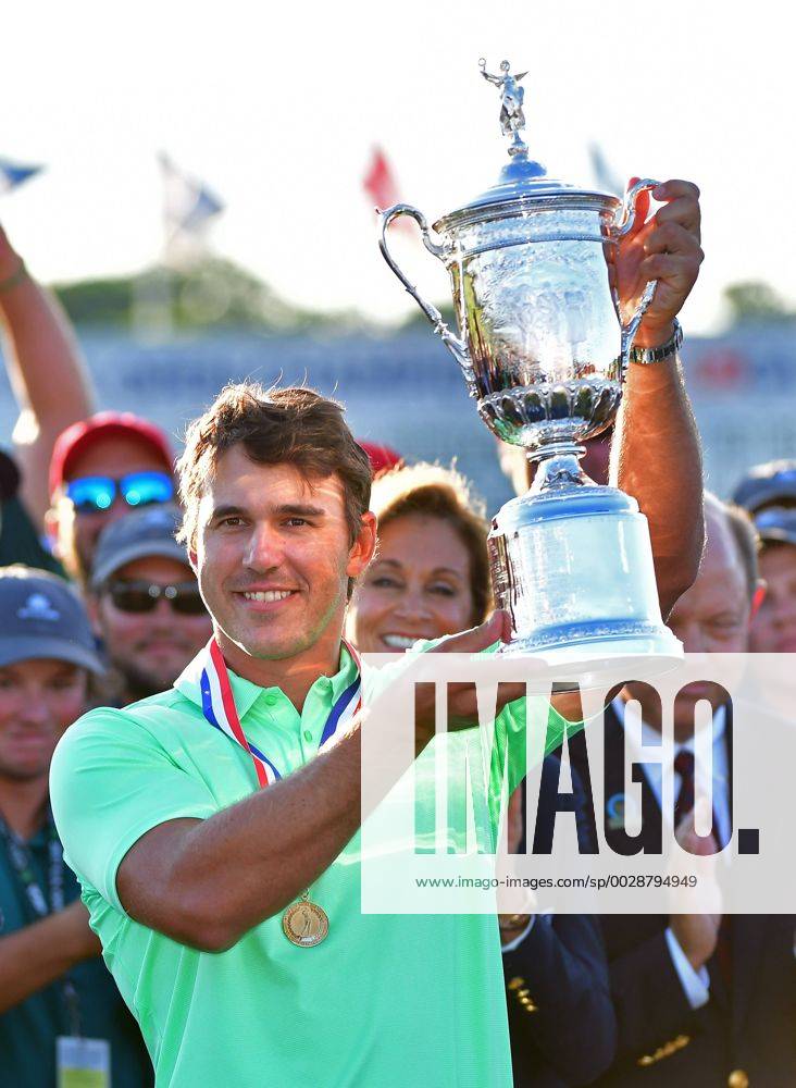 Brooks Koepka holds the trophy after his victory in the 117th U.S. Open golf tournament at Erin Hill golf course on June 18, 2017, in Erin, Wisconsin. Koepka posted a final score of 16-under-par. WIS20170618583 KEVINxDIETSCH