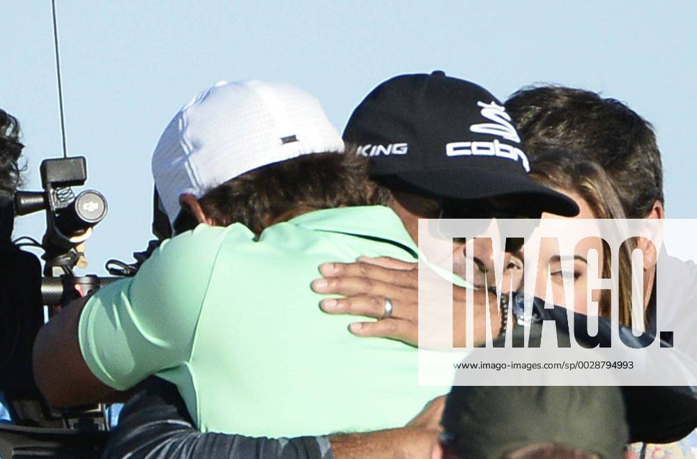 Brooks Koepka is hugged after winning the 117th U.S. Open golf tournament at Erin Hills golf course on June 18, 2017, in Erin, Wisconsin. Koepka posted a final score of 16-under-par. WIS20170618581 BRIANxKERSEY