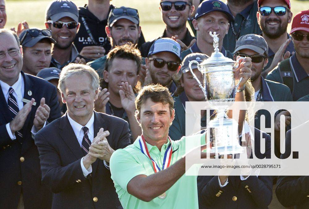 Brooks Koepka holds the trophy after his victory in the 117th U.S. Open golf tournament at Erin Hills golf course on June 18, 2017, in Erin, Wisconsin. Koepka posted a final score of 16-under-par. WIS20170618579 BRIANxKERSEY