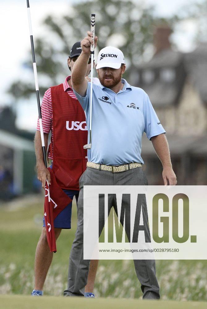 J.B. Holmes lines up a putt on No. 1 during the final round of the 117th U.S. Open golf tournament at Erin Hills golf course on June 18, 2017, in Erin, Wisconsin. WIS20170618519 BRIANxKERSEY