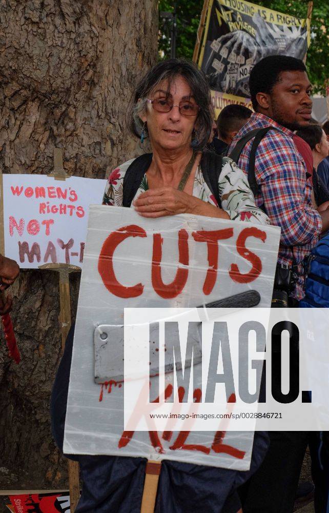 London, United Kingdom - Protestors hold banners as they rally outside Downing street , in London, on June 24, 2017. Hundreds of people gather outside Downing street to protest against the Conservative party, DUP coalition government. Anti-DUP and Conservative party protest In London, UK - ZUMAn230 20170624_zaa_n230_248