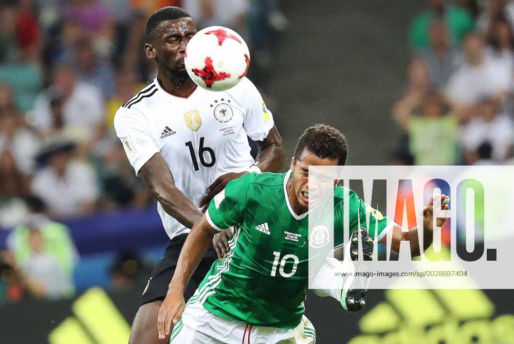 Germany s Antonio Ruediger (L) and Mexico s Giovani dos Santos fight for the ball in their 2017 FIFA Confederations Cup semifinal football match at Fisht Stadium. Artyom Korotayev TASS TS0557D3