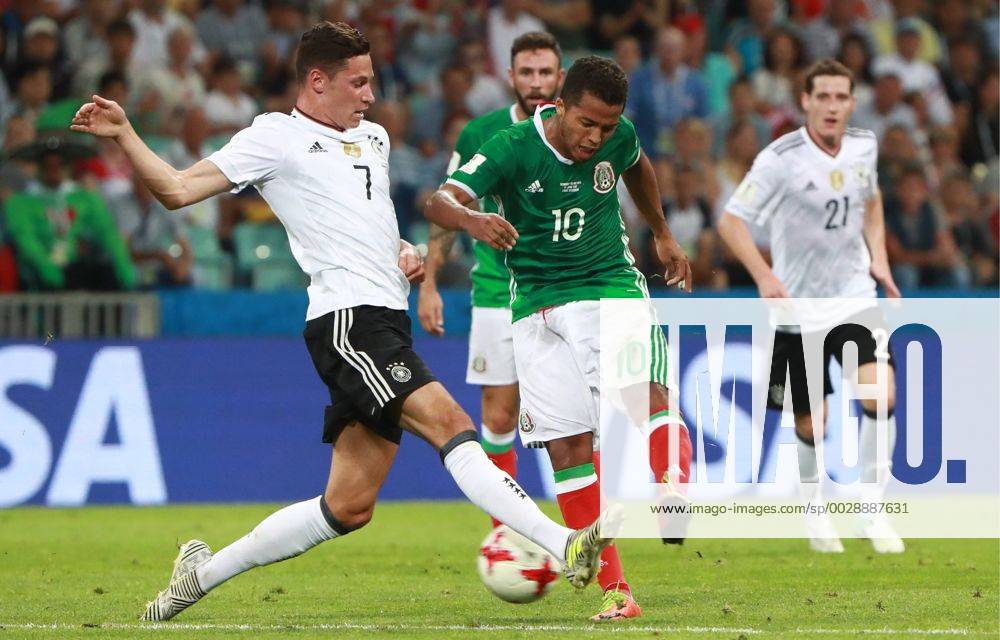 Germany s Julian Draxler (L) and Mexico s Giovani dos Santos fight for the ball in their 2017 FIFA Confederations Cup semifinal football match at Fisht Stadium. Sergei Fadeichev TASS TS0557F0
