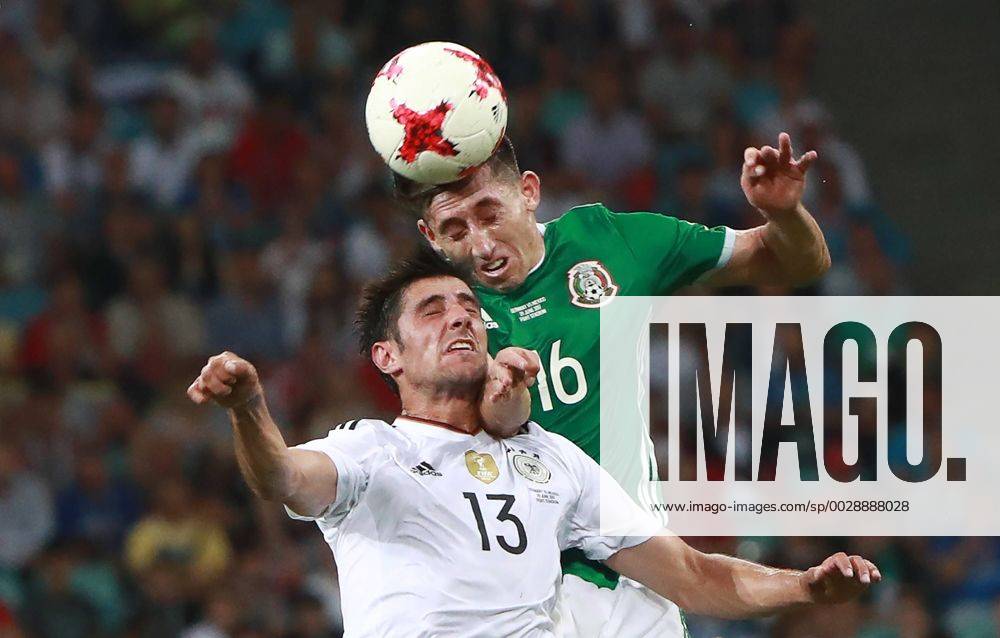 Germany s Lars Stindl (L) and Mexico s Hector Herrera jump to head the ball in their 2017 FIFA Confederations Cup semifinal football match at Fisht Stadium. Sergei Fadeichev TASS TS055818