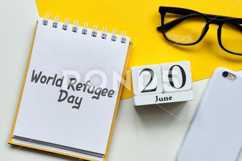 World Refugee Day 20 twentieth june Month Calendar Concept on Wooden Blocks. Close up. twentieth, 20, World, Refugee, june, month, summer, day, calendar, sign, symbol, text, organizer, planner, idea, remind, holiday, event, number, diary, deadline, date, daily, concept, schedule, business, background, reminder, object, style, wall, time, vintage, space, week, white, wooden, year, table, agenda, retro, page, office, monthly, modern, design, conceptual