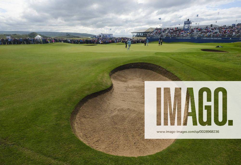 July 7th 2017, Portstewart Golf Club, Portstewart, Northern Ireland; Dubai Duty Free Irish Open Golf Championship, Day 2; Justin Rose (ENG) and Tommy Fleetwood (ENG) on the 18th green in front of the main stand during the second round of the Dubai Duty Free Irish Open Cookex ActionPlus11898844