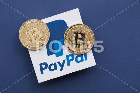 LONDON, UK - March 2021: Bitcoin cryptocurrency on a paypal online payment logo. bitcoin, paypal, business, finance, crypto, crypto currency, coin, payment, digital, gold, money, currency, trade, banking, exchange, symbol, financial, investment, economy, cyberspace, pay, technology, cryptocurrency, cash, security, blockchain, future, earnings, economic, transfer, trading, price, bank, commerce, e-commerce, internet, virtual, online, marketing, brand, company, commercial, consumerism, ecommerce, logo, illustrative editorial, pay pal, software, editorial