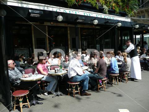 PARIS, FRANCE - Apr 26, 2008: People sitting densely packed in garden of famous Cafe de Flore in Paris, France city, urban, capital, france, french, cafe, bistro, famous, tourism, travel destination, garden, restaurant, cafe de flore, people, sitting, drinking, eating, densley packed