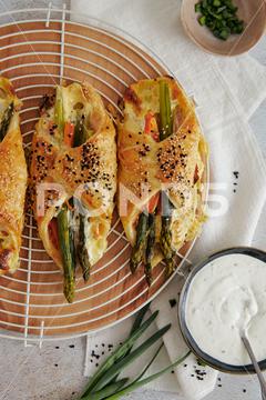 A top view of delicious asparagus carrot dumplings with cream on a white mesh on the table delicious, asparagus, carrot, cream, white, mesh, wooden, wood, board, table, cuisine, dumpling, background, food, traditional, vegetable, bread, dessert, baked, bakery, fresh, tasty, snack, pastry, bake, breakfast, yummy, vertical, top, view