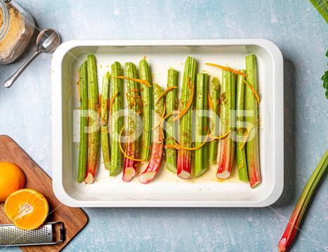 A closeup shot of rhubarb stalks in a rectangle plate. Top view. closeup, rhubarb, stalks, stems, food, fresh, vegetarian, top, view, organic, cooked, meal, dish, dinner, cuisine, delicious, prepared, healthy, plant, vitamin, ingredient, edible, green, species, colors