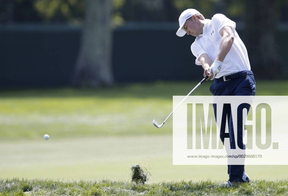 Jordan Spieth hits an iron out of the rough with his approach shot to the first hole green in the final round of The Northern Trust golf championship at the Glen Oaks Club in Old Westbury, New York on August 27, 2017. Glen Oaks Club is hosting THE NORTHERN TRUST for the first time. NYP20170827105 JOHNxANGELILLO