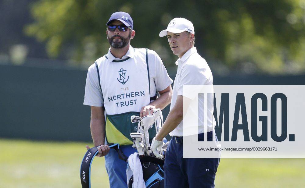 Jordan Spieth and caddie Michael Greller stand on the first hole fairway in the final round of The Northern Trust golf championship at the Glen Oaks Club in Old Westbury, New York on August 27, 2017. Glen Oaks Club is hosting THE NORTHERN TRUST for the first time. NYP20170827106 JOHNxANGELILLO