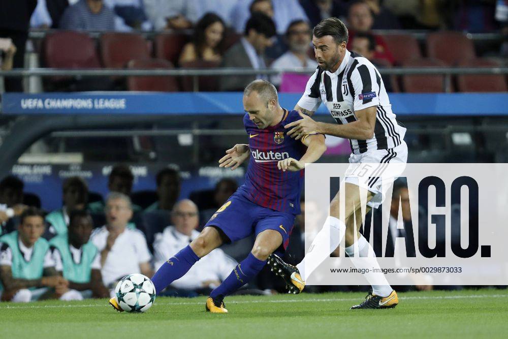 (L-R) Andres Iniesta of FC Barcelona Barca Andrea Barzagli of Juventus FC during the UEFA Champions League group D match between FC Barcelona and Juventus FC on September 12, 2017 at the Camp Nou stadium in Barcelona, Spain. UEFA Champions League 2017 2018 Imagesx xMauricexvanxSteenxIVx 8725728