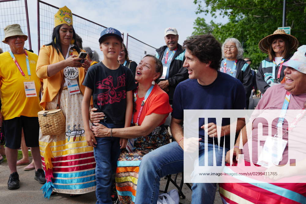 Prime Minister Justin Trudeau, second from right, and his son Hadrien, third from left, are greeted prior to Canoe Kayak competition at the North American Indigenous Games 2023 in Halifax, N.S. on Monday, July 17, 2023. Halifax Canada - ZUMAc35_ 20230717_zaf_c35_065