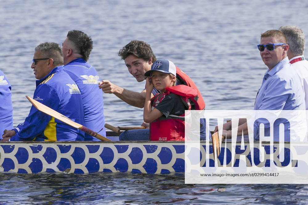 Prime Minister Justin Trudeau, centre, points something out to his son Hadrien as they join chiefs and other dignitaries in paddling across Lake Banook prior to Canoe Kayak competition at the North American Indigenous Games 2023 in Halifax, Monday, July 17, 2023. Halifax Canada - ZUMAc35_ 20230717_zaf_c35_070