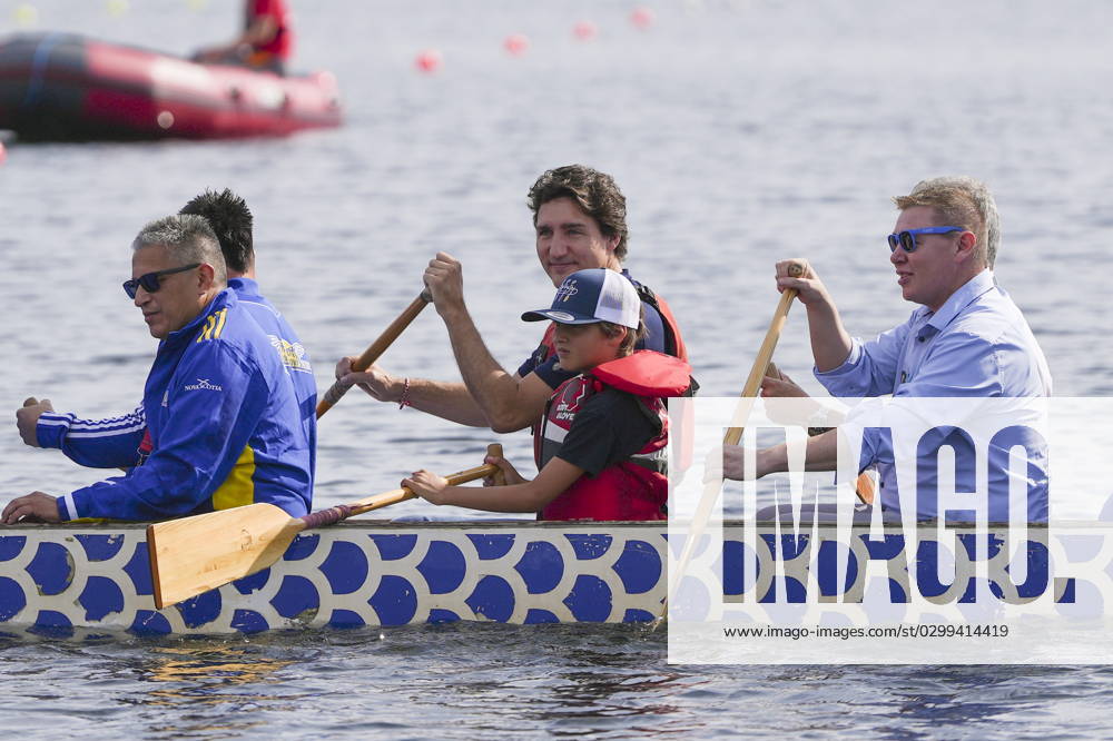 Prime Minister Justin Trudeau, centre, and his son Hadrien join chiefs and other dignitaries in paddling across Lake Banook prior to Canoe Kayak competition at the North American Indigenous Games 2023 in Halifax, Monday, July 17, 2023. Halifax Canada - ZUMAc35_ 20230717_zaf_c35_071